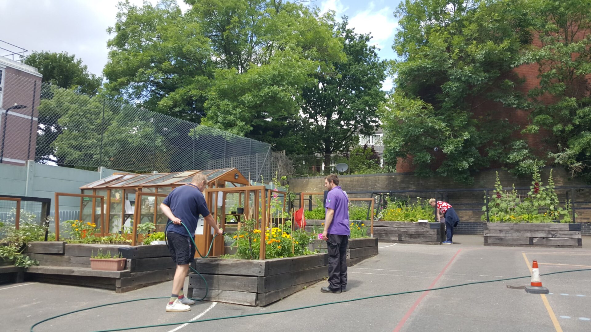 People tending to flower beds.