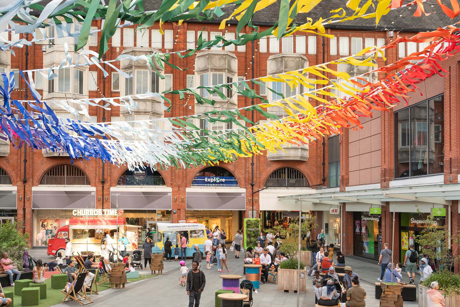 People walking through a shopping centre in Ealing Broadway