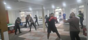 A group of young men during a boxing training session
